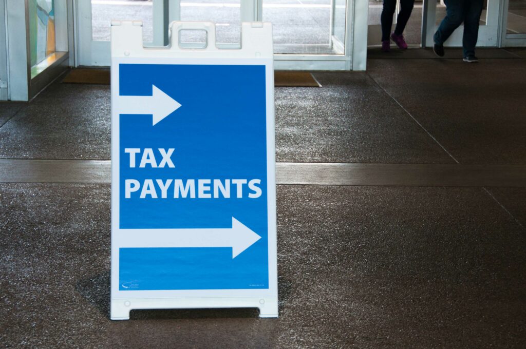 Sign pointing to were to make tax payments