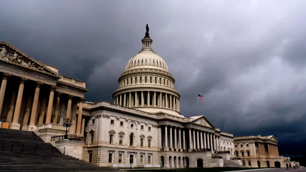 U.S. Capitol with dark clouds in the background