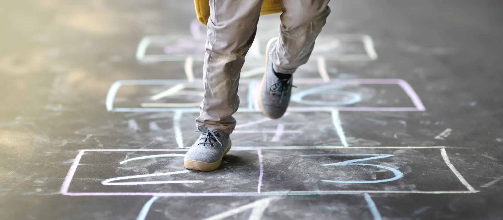 Child playing hopscotch